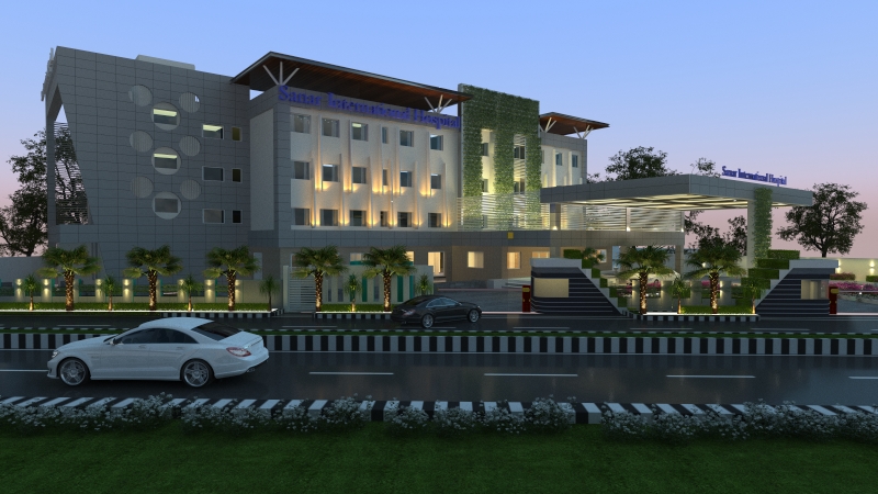 Hospital exterior illuminated at dusk with a clear entrance route